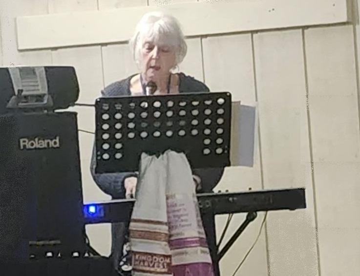 Helen leading worship